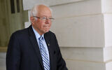 Democratic presidential candidate Sen. Bernie Sanders, I-Vt., departs Capitol Hill in Washington, March 18, 2020, after the Senate passed a second coronavirus response bill. (AP Photo/Patrick Semansky)