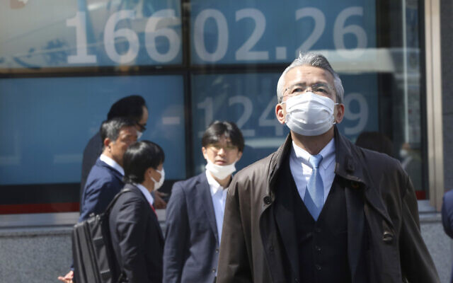 People walk by an electronic stock board of a securities firm in Tokyo, March 19, 2020 as shares in Asia failed to hold onto opening gains. (AP Photo/Koji Sasahara) People walk by an electronic stock board of a securities firm in Tokyo, March 19, 2020 as shares in Asia failed to hold onto opening gains. (AP Photo/Koji Sasahara)