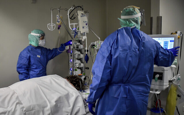 Medical personnel at work in the intensive care unit of the hospital of Brescia, Italy, Thursday, March 19, 2020. (Claudio Furlan/LaPresse via AP) Medical personnel at work in the intensive care unit of the hospital of Brescia, Italy, Thursday, March 19, 2020. (Claudio Furlan/LaPresse via AP)