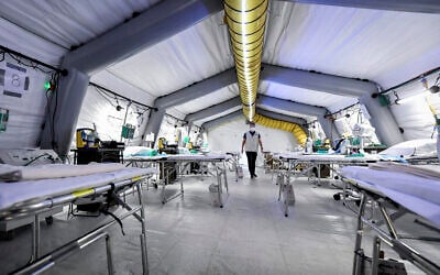 A view of the ICU of the emergency field hospital that is being set up outside Cremona hospital, northern Italy, March 20, 2020. (Claudio Furlan/LaPresse via AP) A view of the ICU of the emergency field hospital that is being set up outside Cremona hospital, northern Italy, March 20, 2020. (Claudio Furlan/LaPresse via AP)