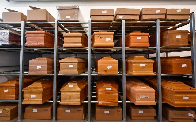 Illustrative: In this March 23, 2020 file photo, coffins are placed on scaffolding in the Crematorium Temple of Piacenza, northern Italy, awaiting cremation due to the coronavirus emergency. (Claudio Furlan/LaPresse via AP) Illustrative: In this March 23, 2020 file photo, coffins are placed on scaffolding in the Crematorium Temple of Piacenza, northern Italy, awaiting cremation due to the coronavirus emergency. (Claudio Furlan/LaPresse via AP)