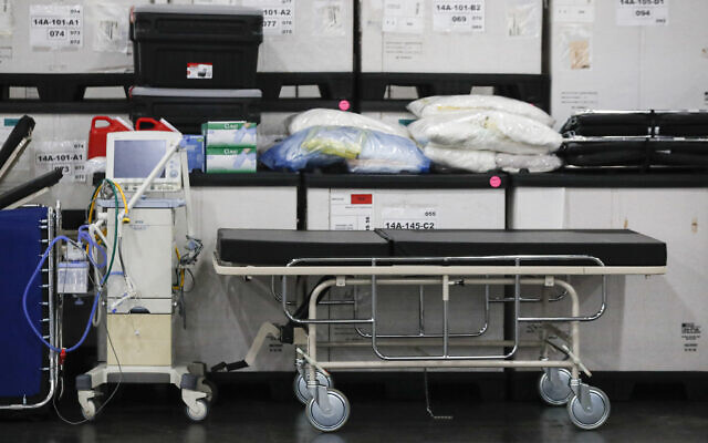 This March 23, 2020, file photo shows medical supplies and a stretcher displayed before a news conference at the Jacob Javits Center in New York. Health care workers are dreading the prospect of deciding which patients would get a ventilator that could save their lives. (John Minchillo, Fle/AP) This March 23, 2020, file photo shows medical supplies and a stretcher displayed before a news conference at the Jacob Javits Center in New York. Health care workers are dreading the prospect of deciding which patients would get a ventilator that could save their lives. (John Minchillo, Fle/AP)