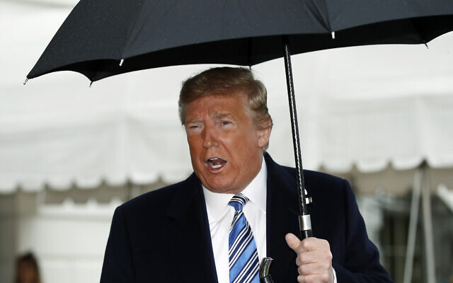 US President Donald Trump speaks about the coronavirus as he walks to Marine One to depart the White House, March 28, 2020, in Washington (AP Photo/Alex Brandon) US President Donald Trump speaks about the coronavirus as he walks to Marine One to depart the White House, March 28, 2020, in Washington (AP Photo/Alex Brandon)