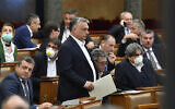 Hungarian Prime Minister Viktor Orban arrives for the plenary session of the Parliament in Budapest, Hungary, on March 30, 2020. (Zoltan Mathe/MTI via AP)