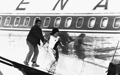 An Israeli grabs the arm of Theresa Khalsa at Lod International Airport in Tel Aviv, Israel on May 9, 1972. (AP Photo)