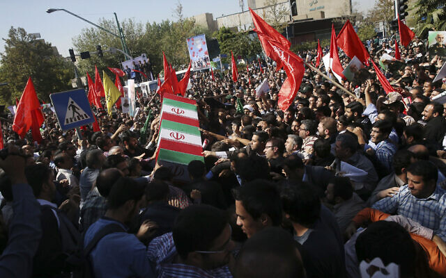 Illustrative: Iranian mourners carry the flag-draped coffin of Revolutionary Guard Gen. Hossein Hamedani during his funeral ceremony in Tehran, Iran, October 11, 2015. Hamedani, a senior commander of the Guard, was killed by Islamic State extremists near the Syrian city of Aleppo, according to a state TV report. (AP Photo/Vahid Salemi) Illustrative: Iranian mourners carry the flag-draped coffin of Revolutionary Guard Gen. Hossein Hamedani during his funeral ceremony in Tehran, Iran, October 11, 2015. Hamedani, a senior commander of the Guard, was killed by Islamic State extremists near the Syrian city of Aleppo, according to a state TV report. (AP Photo/Vahid Salemi)