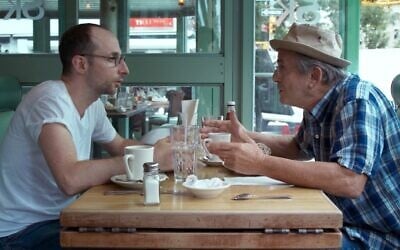 Dov Tiefenbach as Mr. Harchol and Tibor Feldman as Daddy in this still from 'About a teacher.' (Courtesy Hanan Harchol Productions)