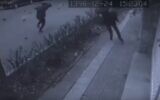 Screen capture from video showing people running for cover as eggplants rain from the sky in a prank clip made in Iran. (YouTube)