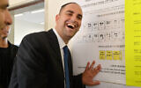 Yair Revivo votes in municipal elections at a polling station in the central city of Lod on October 22, 2013. (Yossi Zeliger/Flash90)