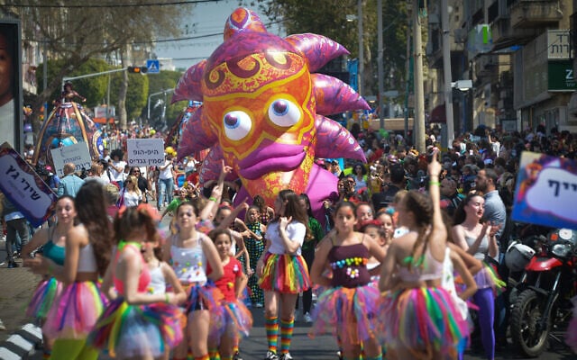 Illustrative: Israelis enjoy a Purim parade, the largest in the country, in the city of Holon, during the Jewish holiday of Purim, March 21, 2019. (Flash90) Illustrative: Israelis enjoy a Purim parade, the largest in the country, in the city of Holon, during the Jewish holiday of Purim, March 21, 2019. (Flash90)
