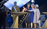 Bat-Galim Shaer (L), Racheli Frenkel (C), and Iris Ifrach (R), light a torch during the main rehearsal of the 71st anniversary Independence Day ceremony, held at Mount Herzl, Jerusalem, on April 6, 2019.(Hadas Parush/Flash90)