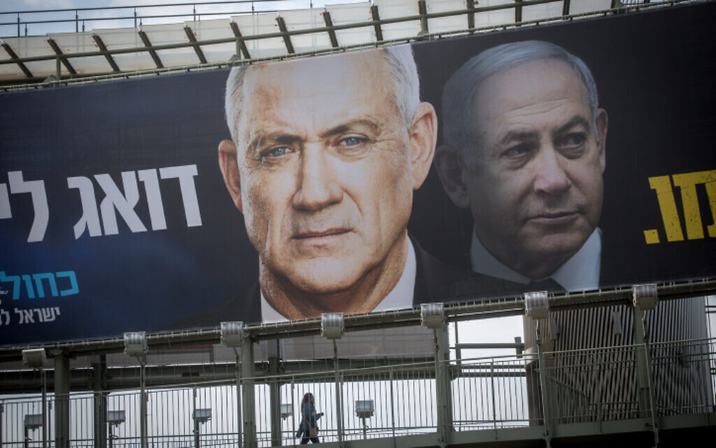 An election poster hung by the Blue and White party shows their candidate Benny Gantz and Likud's Benjamin Netanyahu on February 18, 2020. (Miriam Alster/Flash90) An election poster hung by the Blue and White party shows their candidate Benny Gantz and Likud's Benjamin Netanyahu on February 18, 2020. (Miriam Alster/Flash90)