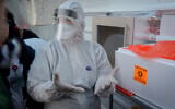 Illustrative: Workers inside a building at Tel Aviv's Tel Hashomer Hospital, which was converted into a coronavirus isolation unit, February 20, 2020. (Avshalom Sassoni/Flash90)