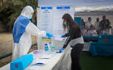 A special polling station for voters quarantined due to possible exposure to the new coronavirus, in Tel Aviv on March 1, 2020. ( Avshalom Sassoni/Flash90)