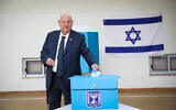 President Reuven Rivlin casts his ballot at a voting station in Jerusalem, during the Knesset Elections, on March 2, 2020 (Olivier Fitoussi/Flash90)