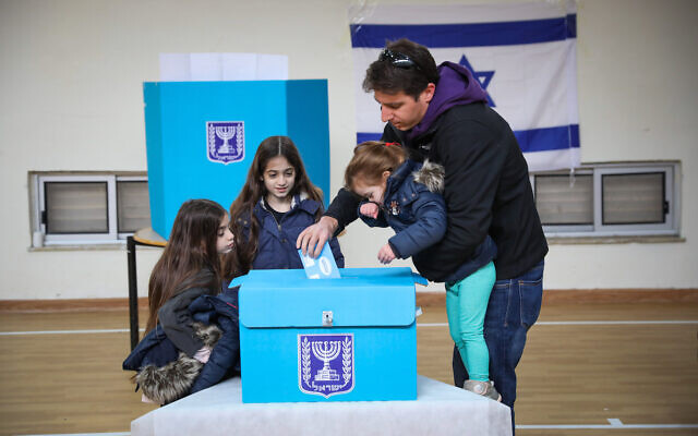 People cast their ballot at a voting station in Jerusalem, during the Knesset Elections, on March 2, 2020. (Olivier Fitoussi/Flash90)
