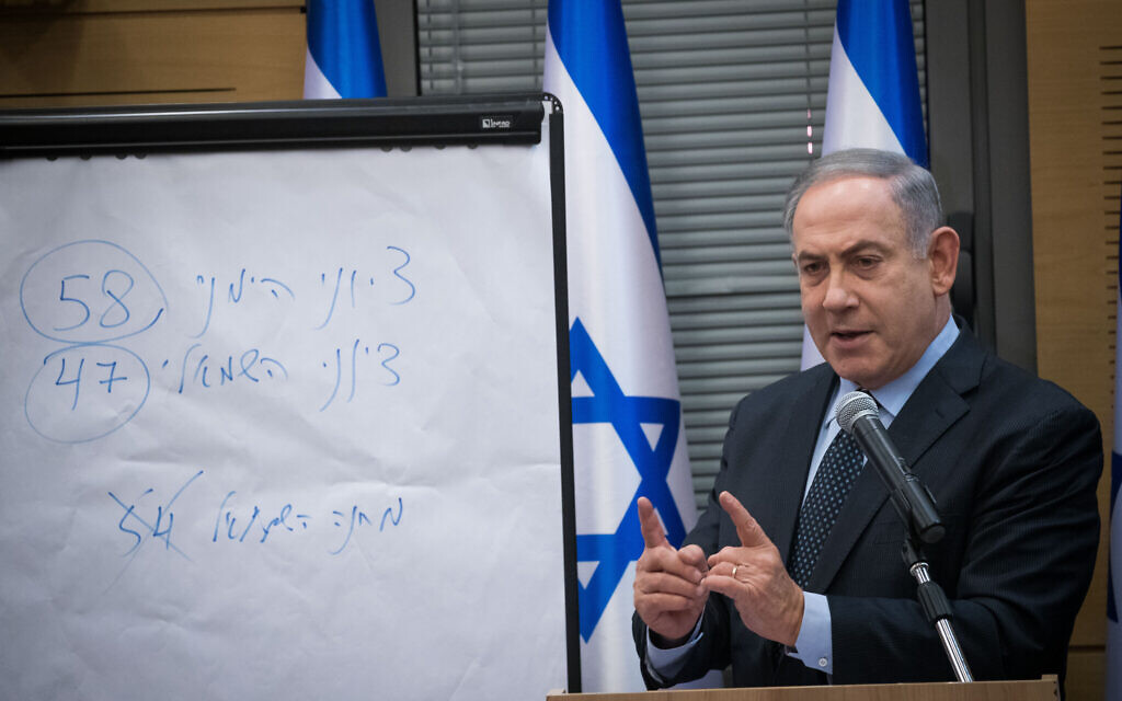 Prime Minister Benjamin Netanyahu addresses a meeting with members of the right-wing and Orthodox parties. On the board, he writes that the Zionist right has won 58 seats in the elections, and the Zionist left 47 -- comprising Blue and White, Yisrael Beytenu and Labor-Gesher-Meretz. (Crossed out is "Left-wing camp - 54.) These figures exclude the Joint List of mainly Arab parties, which won 15 seats in the March 2 election (Yonatan Sindel/Flash90) Prime Minister Benjamin Netanyahu addresses a meeting with members of the right-wing and Orthodox parties. On the board, he writes that the Zionist right has won 58 seats in the elections, and the Zionist left 47 -- comprising Blue and White, Yisrael Beytenu and Labor-Gesher-Meretz. (Crossed out is "Left-wing camp - 54.) These figures exclude the Joint List of mainly Arab parties, which won 15 seats in the March 2 election (Yonatan Sindel/Flash90)
