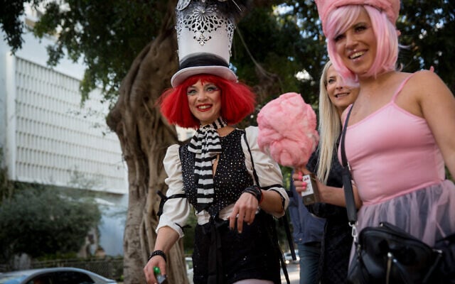 Virus outbreak disrupts joyous Purim fest but some improvise | The Times of  Israel