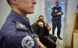 Barak Ben-Ami, center, arrives for a court hearing at the Petah Tikva  Magistrate's Court on March 8, 2020. (Avshalom Sassoni/Flash90)