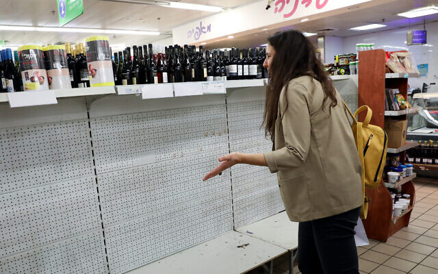 Empty shelves in a supermarket in Tel Aviv. People are stocking up on food supplies in fear they may run out, or have to be in self-quarantine, as Israel takes stricter precautions on the coronavirus. March 10, 2020. (Yossi Zamir/FLASH90) Empty shelves in a supermarket in Tel Aviv. People are stocking up on food supplies in fear they may run out, or have to be in self-quarantine, as Israel takes stricter precautions on the coronavirus. March 10, 2020. (Yossi Zamir/FLASH90)