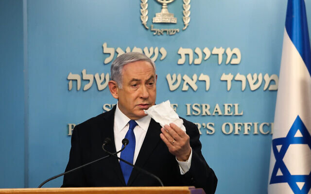 Prime Minister Benjamin Netanyahu announces new restrictions to combat the COVID-19 coronavirus during a press conference at his office in Jerusalem on March 11, 2020. (Flash90) Prime Minister Benjamin Netanyahu announces new restrictions to combat the COVID-19 coronavirus during a press conference at his office in Jerusalem on March 11, 2020. (Flash90)