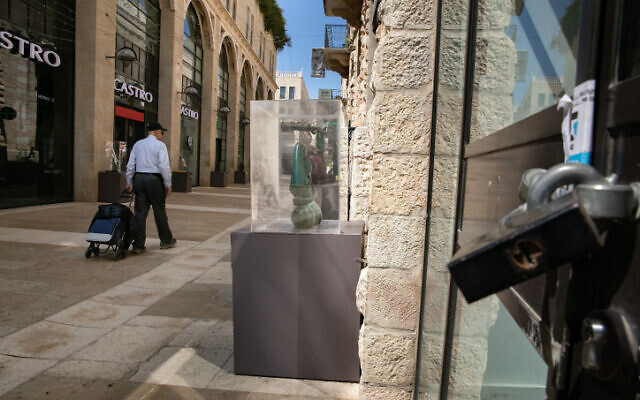 An Israeli man walking past closed stores in the normally bustling Mamilla outdoor mall in Jerusalem, on March 16, 2020. (Olivier Fitoussi/Flash90) An Israeli man walking past closed stores in the normally bustling Mamilla outdoor mall in Jerusalem, on March 16, 2020. (Olivier Fitoussi/Flash90)