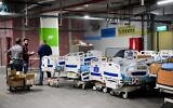 Illustrative: Workers prepare new wards for coronavirus patients at Sheba Hospital in Tel Hashomer on March 17, 2020. (Flash90)