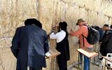 Worshipers at the Western Wall on March 10, 2020. (Jacob Magid/Times of Israel)