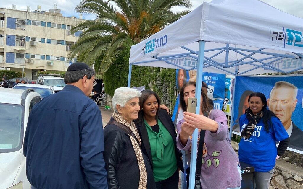 Blue and White MK Pnina Tamano Shata takes a photo with supporters outside of a polling station in Kiryat Malachi on March 2, 2020. (Jacob Magid/Times of Israel) Blue and White MK Pnina Tamano Shata takes a photo with supporters outside of a polling station in Kiryat Malachi on March 2, 2020. (Jacob Magid/Times of Israel)