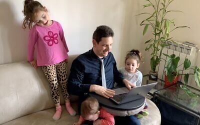 Eliav Rodman, chief marketing officer of myInterview, working from home surrounded by his three children in Jerusalem; March 26, 2020 (Maor Rodman)
