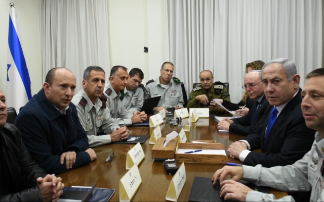 Prime Minister Benjamin Netanyahu, Defense Minister Naftali Bennett and senior officials from Israel's security services, including Maj. Gen. Aharon Haliva, center-left, meet to discuss growing tensions with terror groups in the Gaza Strip at the military's Tel Aviv headquarters on February 23, 2020. (Tal Oz/Defense Ministry) Prime Minister Benjamin Netanyahu, Defense Minister Naftali Bennett and senior officials from Israel's security services, including Maj. Gen. Aharon Haliva, center-left, meet to discuss growing tensions with terror groups in the Gaza Strip at the military's Tel Aviv headquarters on February 23, 2020. (Tal Oz/Defense Ministry)