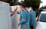 An Israeli in quarantine after returning from Thailand gives the finger to Health Ministry inspectors who visited his home on February 23, 2020. (Screen capture/YouTube)
