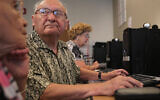 Residents learn how to use Facebook at the Jewish Community Housing for the Elderly in Massachusetts. (Suzanne Kreiter/Getty Images)
