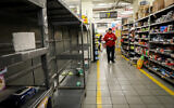 Empty shelves at a supermarket in Jerusalem, March 14, 2020. (Yossi Zamir/Flash90)