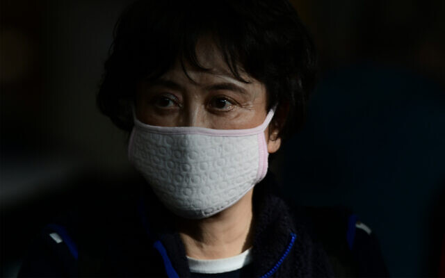 A woman wears a protective face mask amid coronavirus fears at the arrival hall of Ben Gurion Airport, near Tel Aviv, January 30, 2020. (Tomer Neuberg/Flash90) A woman wears a protective face mask amid coronavirus fears at the arrival hall of Ben Gurion Airport, near Tel Aviv, January 30, 2020. (Tomer Neuberg/Flash90)
