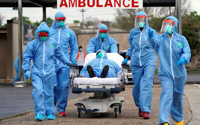 A person is taken on a stretcher into treatment after going through testing for the coronavirus in Houston, Texas, March 19, 2020. (AP/David J. Phillip)