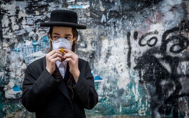 An ultra-Orthodox youth in Jerusalem, March 16, 2020. (Yonatan Sindel/Flash90)