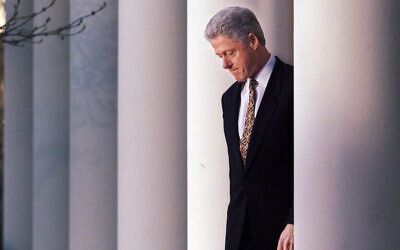 US President Bill Clinton walks to the podium to deliver a short statement on his impeachment at the White House in Washington, Dec. 11, 1998. (AP Photo/J. Scott Applewhite)