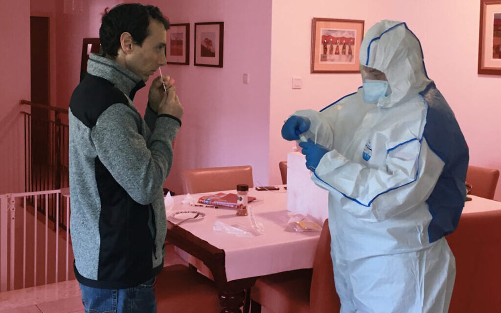 The author is tested for coronavirus while under quarantine in Israel. (Courtesy/Uriel Heilman) The author is tested for coronavirus while under quarantine in Israel. (Courtesy/Uriel Heilman)