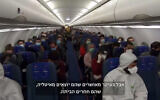 Israelis flee Milan on an Israir "rescue flight." (Screenshot/Channel 13)