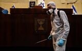 A worker disinfecting the Knesset on March 15, 2020. (Adine Wolman/Knesset Spokesperson's Office)