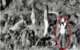 A person films Israel from the buffer zone between Syria and Israel in what the IDF says was an effort to prepare for a sniper attack, as seen in a surveillance photo released by the military on March 17, 2020. (Israel Defense Forces)