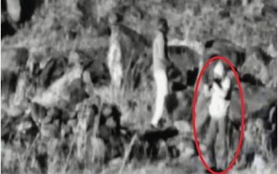 A person films Israel from the buffer zone between Syria and Israel in what the IDF says was an effort to prepare for a sniper attack, as seen in a surveillance photo released by the military on March 17, 2020. (Israel Defense Forces)