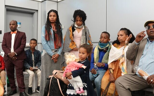 Ethiopian immigrants shortly after landing at Ben Gurion Airport, March 24, 2020. (Michael Dimenstein/ GPO) Ethiopian immigrants shortly after landing at Ben Gurion Airport, March 24, 2020. (Michael Dimenstein/ GPO)
