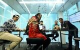 Employees are pictured at the headquarters housing Alibaba, Iran's largest online travel booking service, in the capital Tehran, February 17, 2020. (ATTA KENARE / AFP)