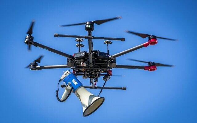 A drone used by police to control people and to ask them to respect social distances at a shopping boulevard in Heerlen, the Netherlands, April 4, 2020. (Marcel VAN HOORN / ANP / AFP) A drone used by police to control people and to ask them to respect social distances at a shopping boulevard in Heerlen, the Netherlands, April 4, 2020. (Marcel VAN HOORN / ANP / AFP)