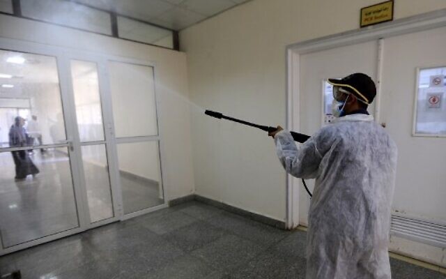 A man sprays disinfectant at the Central Health Laboratory in the Yemeni capital Sanaa, amid the novel coronavirus pandemic, on April 11, 2020. (MOHAMMED HUWAIS / AFP) A man sprays disinfectant at the Central Health Laboratory in the Yemeni capital Sanaa, amid the novel coronavirus pandemic, on April 11, 2020. (MOHAMMED HUWAIS / AFP)