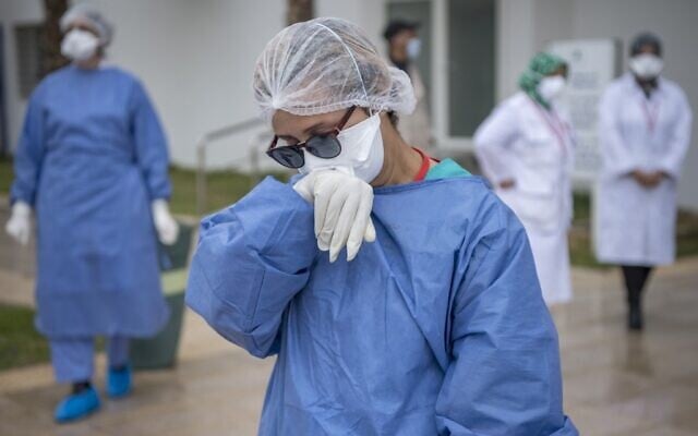 Illustrative -- Members of the medical staff of a hospital where patients suffering from the Covid-19 disease caused by the novel coronavirus are treated, in the city of Sale, north of the Moroccan capital Rabat, on April 12, 2020. (FADEL SENNA / AFP) Illustrative -- Members of the medical staff of a hospital where patients suffering from the Covid-19 disease caused by the novel coronavirus are treated, in the city of Sale, north of the Moroccan capital Rabat, on April 12, 2020. (FADEL SENNA / AFP)