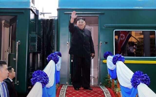 This file photo taken on March 2, 2019 shows North Korea's leader Kim Jong Un waving before boarding his train at the Dong Dang railway station in the Vietnamese town of Lang Son. (Photo by STR / Vietnam News Agency / AFP)
