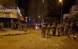 Lebanese army soldiers clash with protesters amid overnight confrontations in Lebanon's northern city of Tripoli late on April 29, 2020. (Fathi AL-MASRI / AFP)